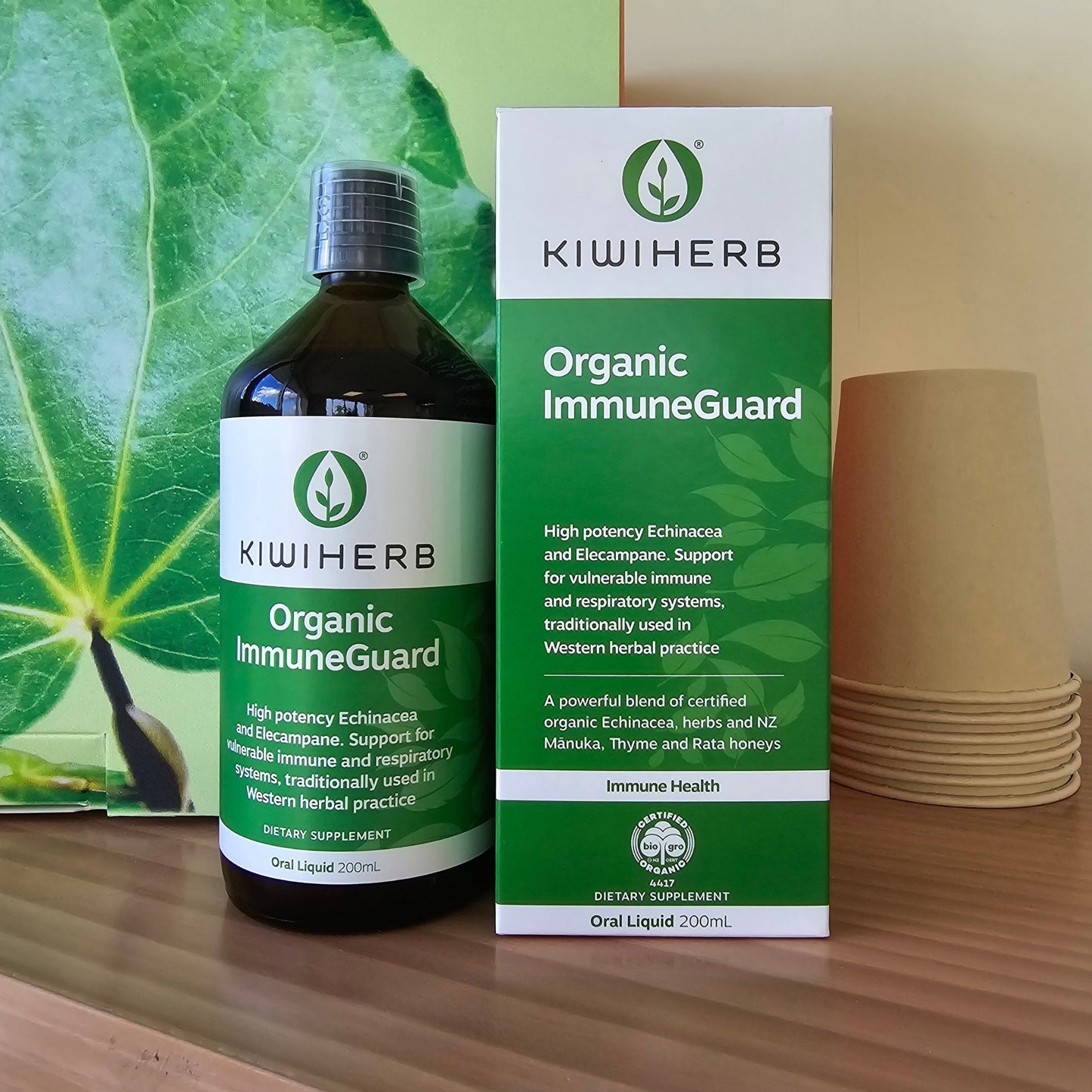 A bottle of Organic ImmuneGuard on a wooden shelf.