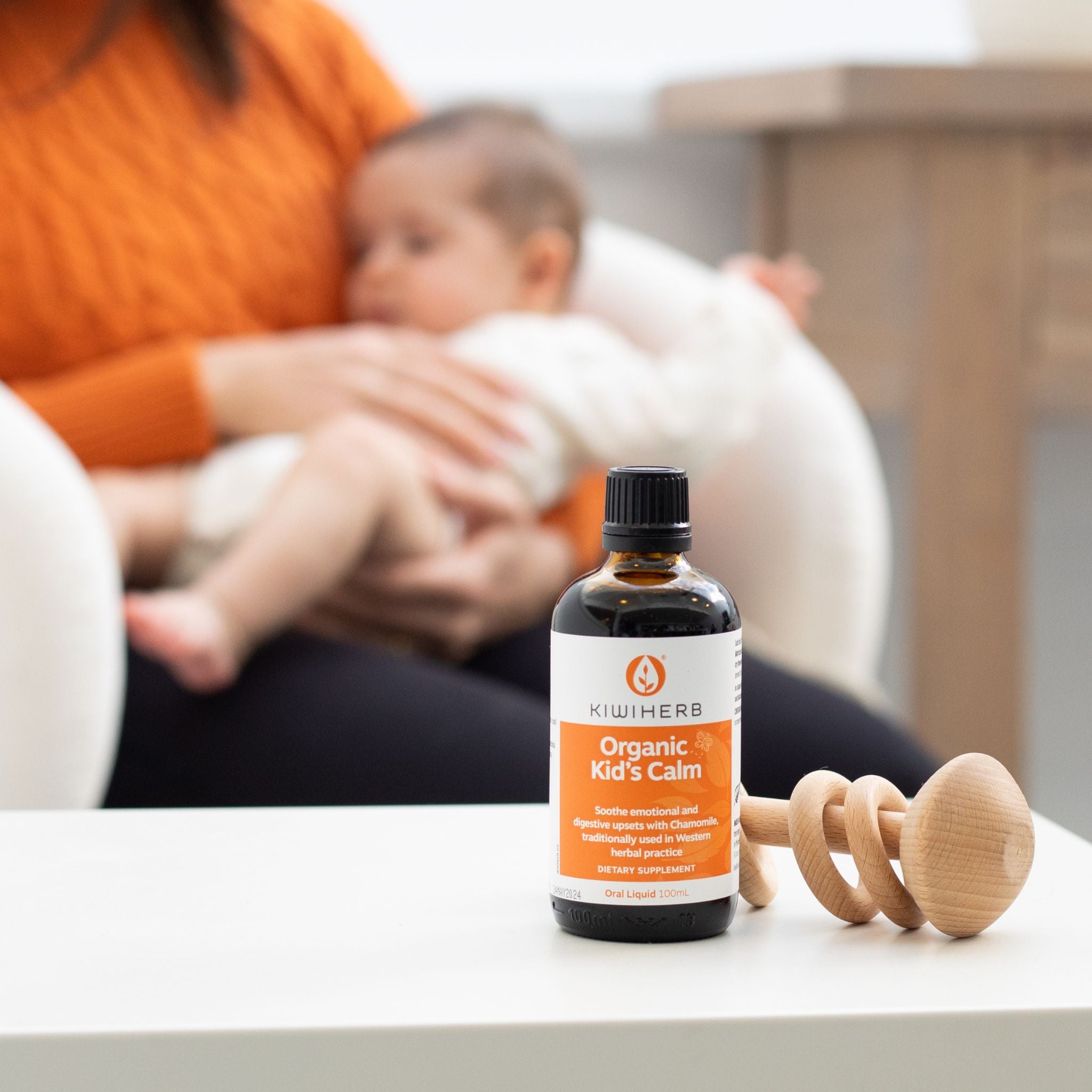 Organic Kid's Calm with a woman holding her baby.