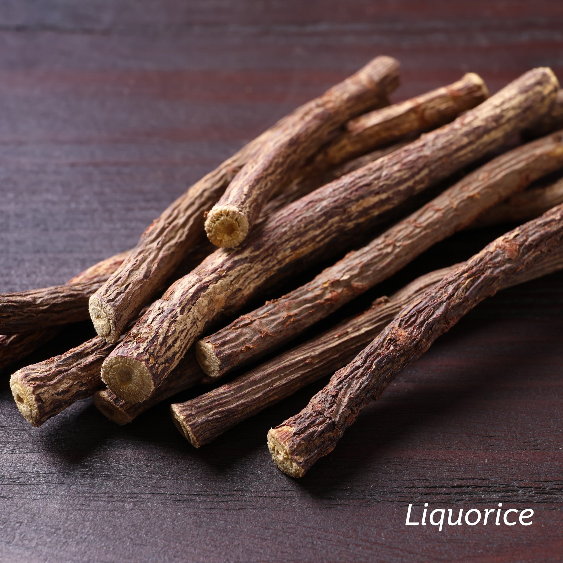 Sticks of Liquorice on a wooden table.